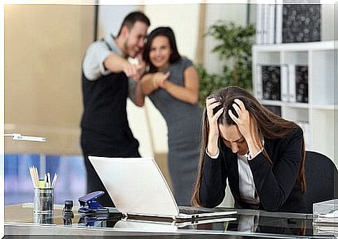 Woman sitting with hands in her hair