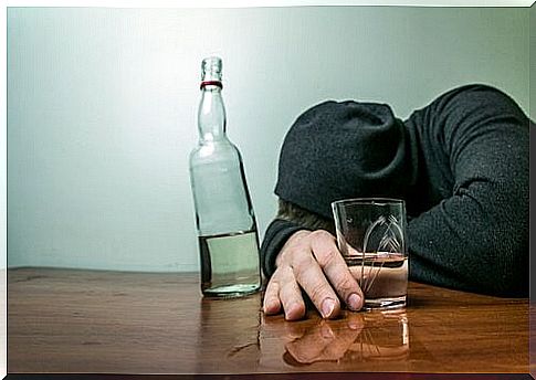 Drunk man lies with his head on the table