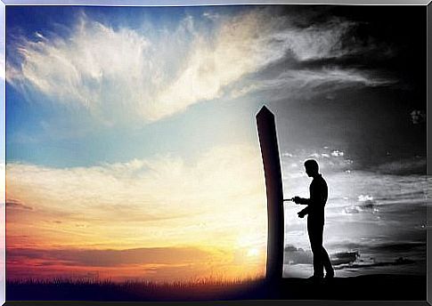 Man standing next to a pole