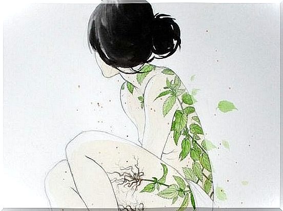 Girl with tree leaves on her skin.