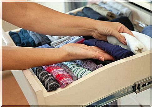 Woman tidying up her drawer as a form of housework