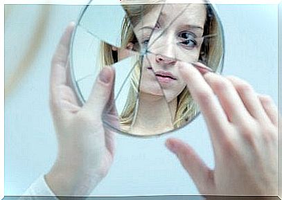 Woman with broken mirror