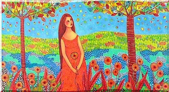 Woman in a flower field enjoying the abundance in her life