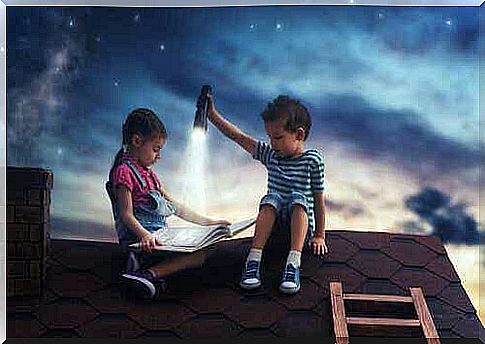 Two children reading on the roof