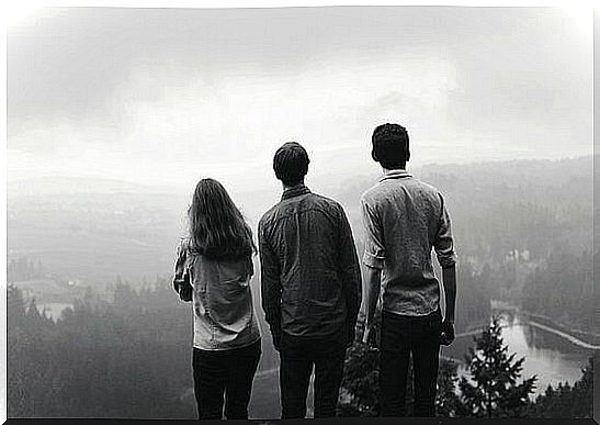 Three Friends Standing On A Mountain