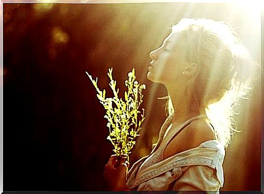 Girl Standing Under A Light With A Bunch Of Grass In Her Hands And Thinking Let Your Own Light Shine May