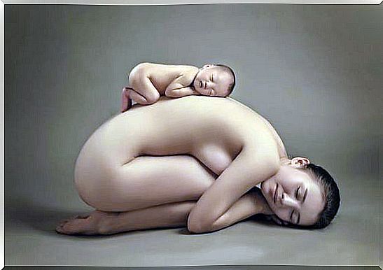 Naked woman with a baby on her back