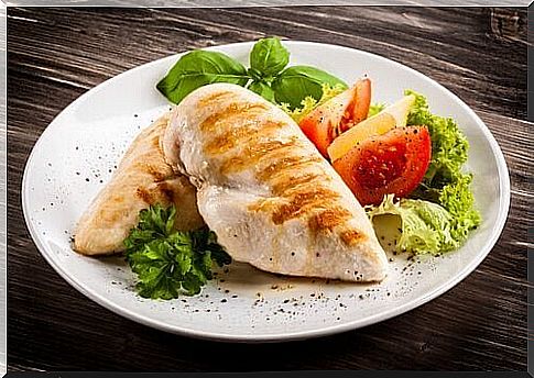 Chicken breast on a plate with salad