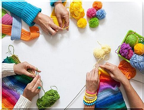 Group of friends knitting together